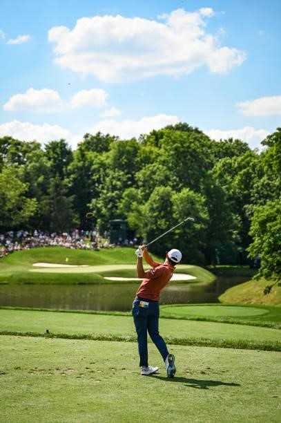 Collin Morikawa follows through as he plays his shot from the 12th tee during the third round of the Memorial Tournament presented by Nationwide at...