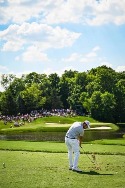 Patrick Cantlay makes impact as he plays his shot from the 12th tee during the third round of the Memorial Tournament presented by Nationwide at...