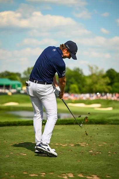 Carlos Ortiz of Mexico makes impact as he plays his shot from the 16th tee during the third round of the Memorial Tournament presented by Nationwide...