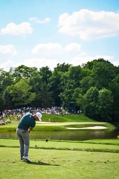 Xander Schauffele makes impact as he plays his shot from the 12th tee during the third round of the Memorial Tournament presented by Nationwide at...