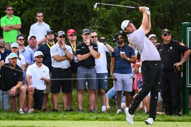 Scottie Scheffler plays his shot from the 16th tee during the third round of the Memorial Tournament presented by Nationwide at Muirfield Village...