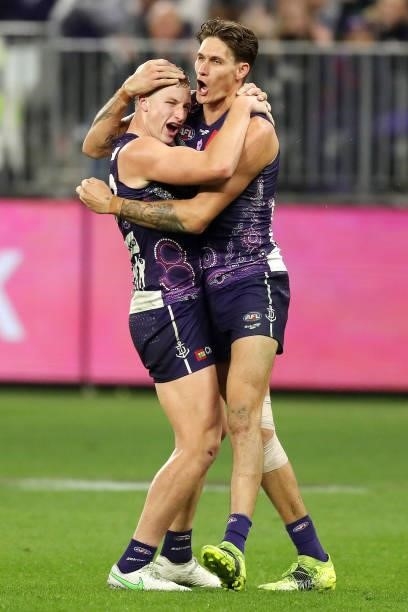 Josh Treacy of the Dockers celebrates after scoring a goal on the siren during the 2021 AFL Round 12 match between the Fremantle Dockers and the...