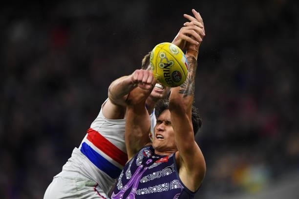 Rory Lobb of the Dockers has his mark spoiled by Zaine Cordy of the Bulldogs during the 2021 AFL Round 12 match between the Fremantle Dockers and the...