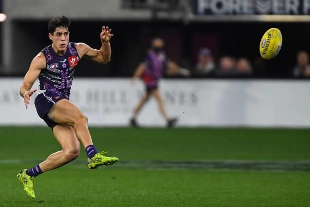 Adam Cerra of the Dockers kicks the ball during the 2021 AFL Round 12 match between the Fremantle Dockers and the Western Bulldogs at Optus Stadium...