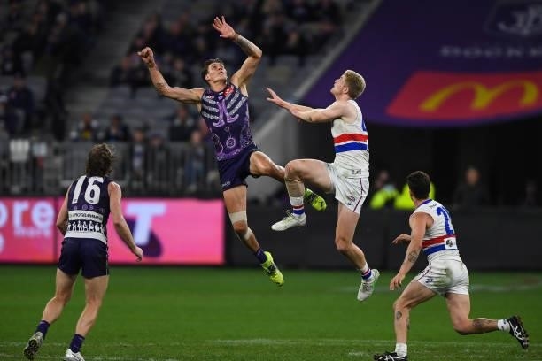 Rory Lobb of the Dockers competes in a ruck contest with Tim English of the Bulldogs during the 2021 AFL Round 12 match between the Fremantle Dockers...
