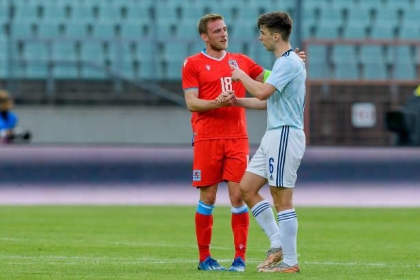 Laurent Jans of Luxembourg and Kieran Tierney of Scotland speaks with during the international friendly match between Luxembourg and Scotland at...