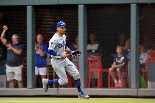 Mookie Betts of the Los Angeles Dodgers field a fly ball in the bottom of the 4th inning against the Atlanta Braves at Truist Park on June 6, 2021 in...