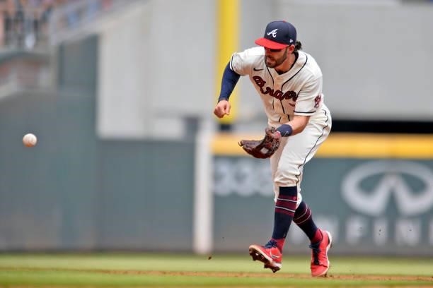 Dansby Swanson of the Atlanta Braves fields a ground ball hit by Will Smith in the top of the 5th inning against the Los Angeles Dodgers at Truist...