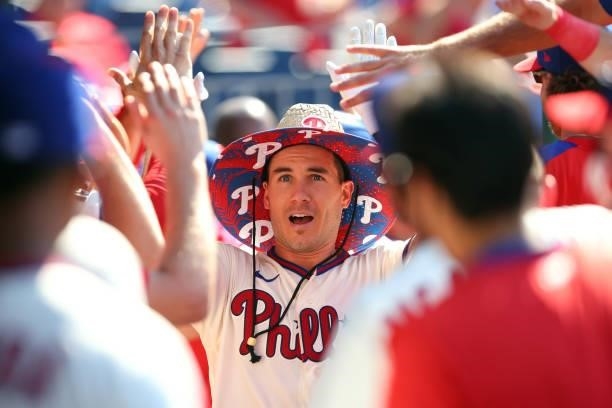 Realmuto of the Philadelphia Phillies is congratulated by teammates after hitting a three-run home run during the sixth inning of a game against the...
