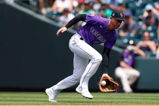Ryan McMahon of the Colorado Rockies commits a fielding error during the fourth inning against the Oakland Athletics at Coors Field on June 6, 2021...