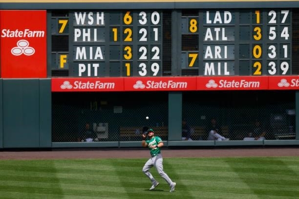 Right fielder Seth Brown of the Oakland Athletics catches a fly ball during the fourth inning against the Colorado Rockies at Coors Field on June 6,...