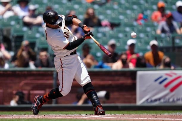 Donovan Solano of the San Francisco Giants hits an RBI single during the game between the Chicago Cubs and the San Francisco Giants at Oracle Park on...