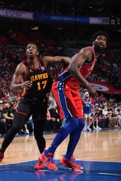 Onyeka Okongwu of the Atlanta Hawks and Joel Embiid of the Philadelphia 76ers fight for the rebound during Round 2, Game 1 of the Eastern Conference...