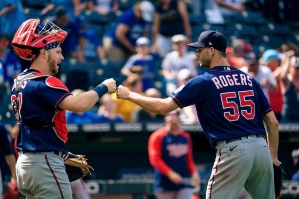Taylor Rogers of the Minnesota Twins and Ryan Jeffers celebrate the victory over the Kansas City Royals at Kauffman Stadium on June 6, 2021 in Kansas...