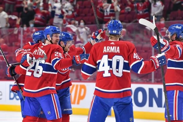 June 6: Corey Perry of the Montreal Canadiens celebrates with teammates after scoring a goal against the Winnipeg Jets in Game Three of the Second...