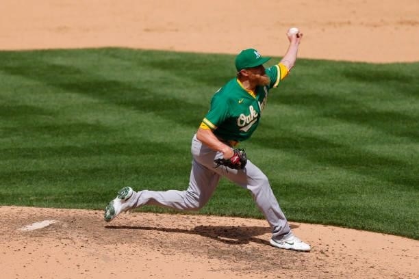 Relief pitcher Jake Diekman of the Oakland Athletics delivers to home plate during the seventh inning against the Colorado Rockies at Coors Field on...