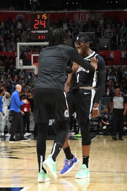 Terance Mann of the LA Clippers and Reggie Jackson celebrate during Round 1, Game 7 of the 2021 NBA Playoffs on June 6, 2021 at STAPLES Center in Los...