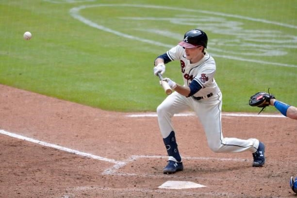 Max Fried of the Atlanta Braves bunts to advance two runners in the bottom of the 6th inning against the Los Angeles Dodgers at Truist Park on June...