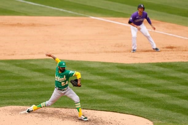 Relief pitcher Sergio Romo of the Oakland Athletics delivers to home plate during the sixth inning as Joshua Fuentes of the Colorado Rockies leads...