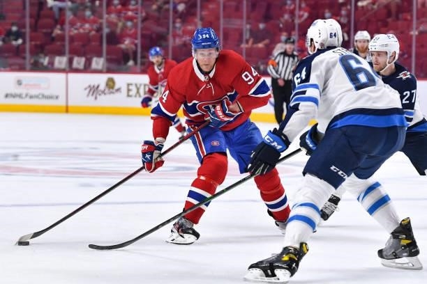June 6: Corey Perry of the Montreal Canadiens prepares a shot while being challenged by Logan Stanley of the Winnipeg Jets in Game Three of the...