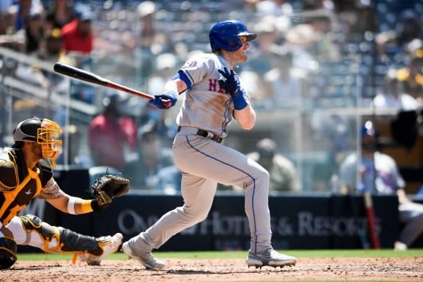 Billy McKinney of the New York Mets hits a single during the sixth inning of a baseball game against San Diego Padres at Petco Park on June 6, 2021...