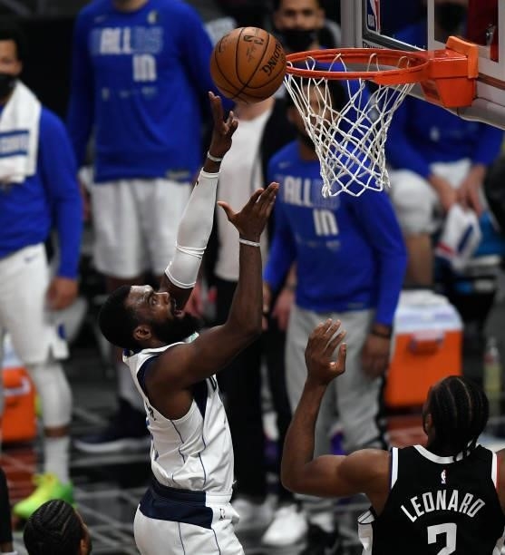 Tim Hardaway Jr. #11 of the Dallas Mavericks scores a basket against Kawhi Leonard of the Los Angeles Clippers during the first half of Game Seven of...