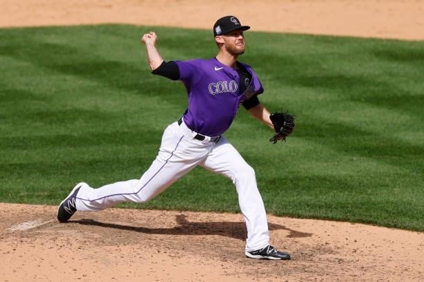 Relief pitcher Daniel Bard of the Colorado Rockies delivers to home plate during the ninth inning against the Oakland Athletics at Coors Field on...