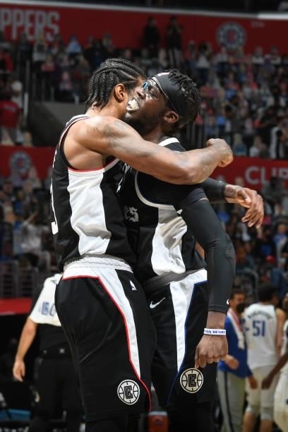 Paul George and Reggie Jackson of the LA Clippers hug during Round 1, Game 7 of the 2021 NBA Playoffs on June 6, 2021 at STAPLES Center in Los...