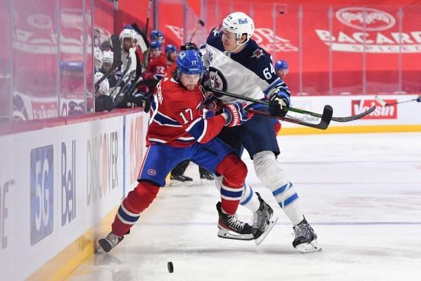June 6: Logan Stanley of the Winnipeg Jets tries to slow down Josh Anderson of the Montreal Canadiens in Game Three of the Second Round of the 2021...
