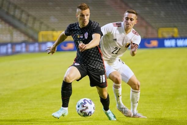 Milan Badelj of Croatia is challenged by Timothy Castagne of Belgium during the international friendly match between Belgium and Croatia at King...
