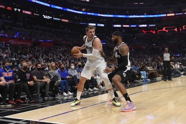 Marcus Morris Sr. #8 of the LA Clippers plays defense on Luka Doncic of the Dallas Mavericks during Round 1, Game 7 of the 2021 NBA Playoffs on June...