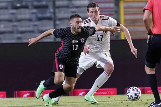 Nikola Vlasic of Croatia competes for the ball with Hans Vanaken of Belgium during the international friendly match between Belgium and Croatia at...