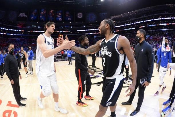 Boban Marjanovic of the Dallas Mavericks and Kawhi Leonard of the LA Clippers shake hands after the game during Round 1, Game 7 of the 2021 NBA...