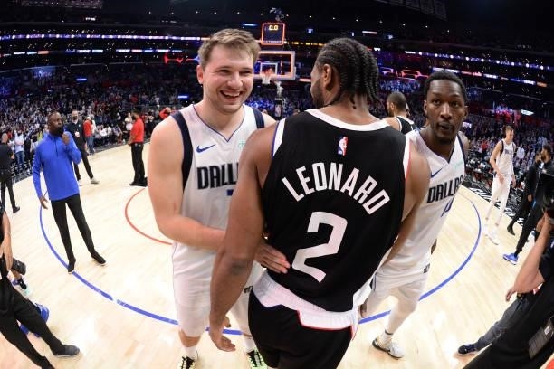 Kawhi Leonard of the LA Clippers and Luka Doncic of the Dallas Mavericks embrace after the game during Round 1, Game 7 of the 2021 NBA Playoffs on...