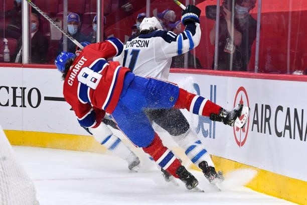 June 6: Ben Chiarot of the Montreal Canadiens slides into the boards while skating for the puck against Nate Thompson of the Winnipeg Jets in Game...