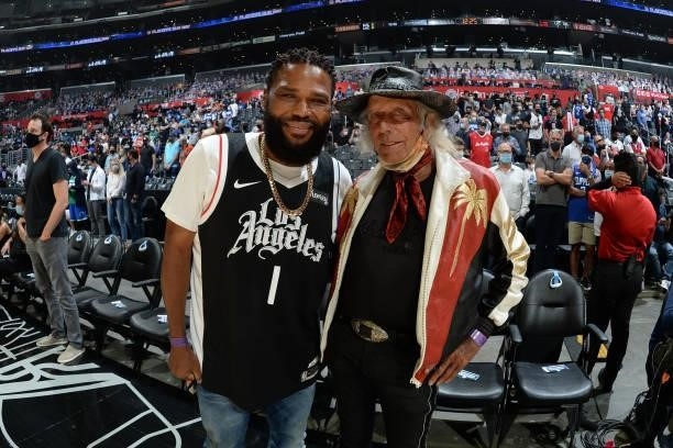 Actor, Anthony Anderson and NBA Super fan, James Goldstein look on during Round 1, Game 7 of the 2021 NBA Playoffs between the Dallas Mavericks and...