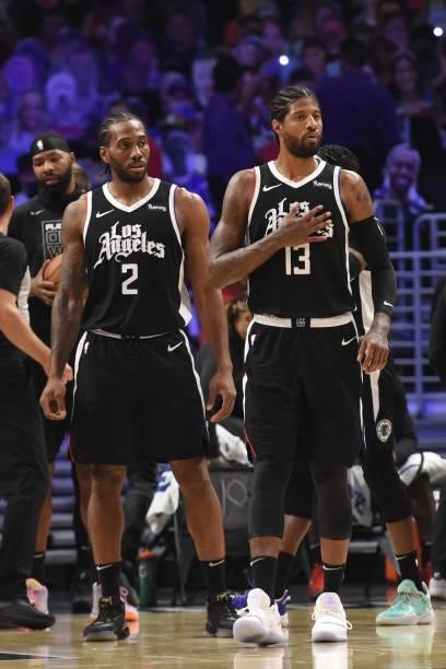 Kawhi Leonard of the LA Clippers and Paul George of the LA Clippers look on during Round 1, Game 7 of the 2021 NBA Playoffs on June 6, 2021 at...
