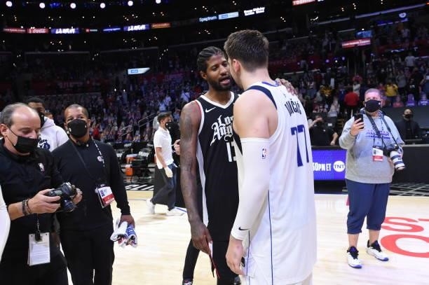 Paul George of the LA Clippers hugs Luka Doncic of the Dallas Mavericks after Round 1, Game 7 of the 2021 NBA Playoffs on June 6, 2021 at STAPLES...