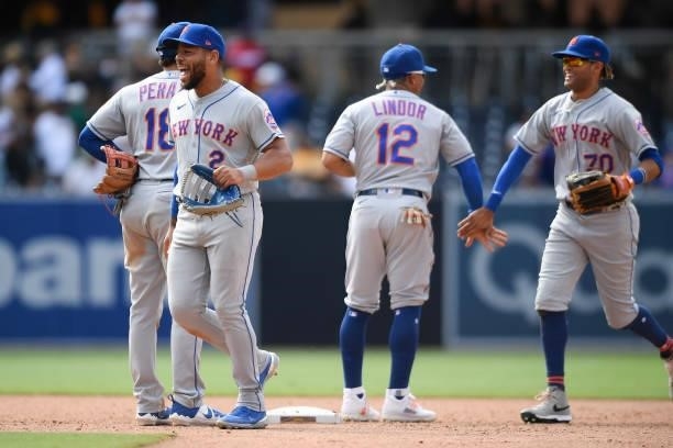 New York Mets players high-five after a 6-2 win over the San Diego Padres at Petco Park on June 6, 2021 in San Diego, California.
