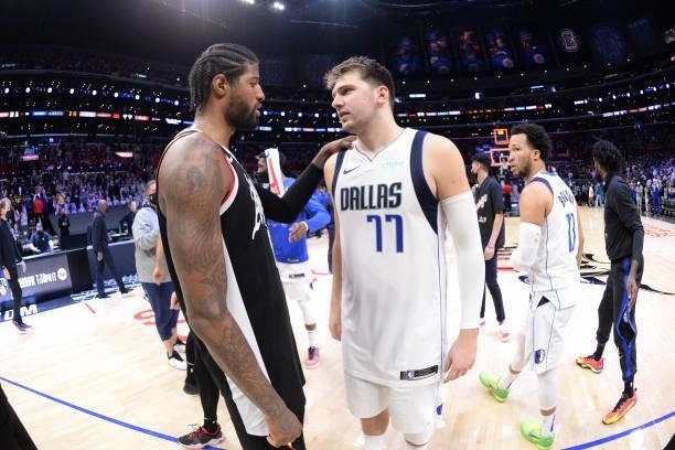 Paul George of the LA Clippers and Luka Doncic of the Dallas Mavericks embrace after the game during Round 1, Game 7 of the 2021 NBA Playoffs on June...