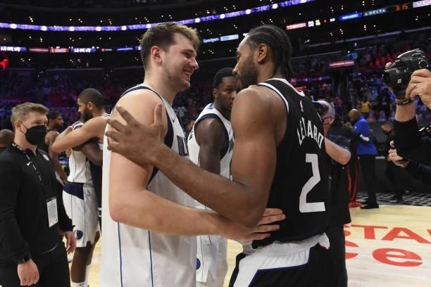 Kawhi Leonard of the LA Clippers high fives Luka Doncic of the Dallas Mavericks after Round 1, Game 7 of the 2021 NBA Playoffs on June 6, 2021 at...