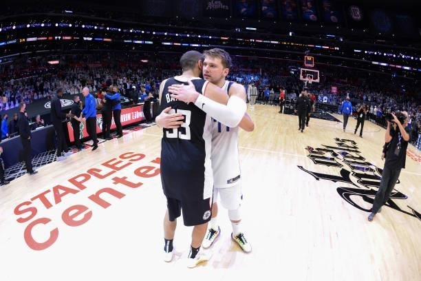 Nicolas Batum of the LA Clippers and Luka Doncic of the Dallas Mavericks embrace after the game during Round 1, Game 7 of the 2021 NBA Playoffs on...