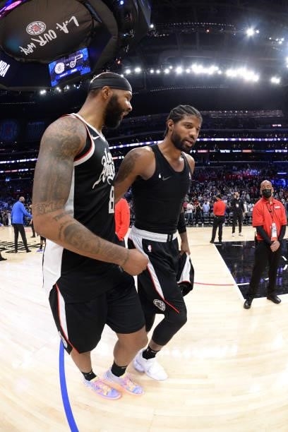 Marcus Morris Sr. #8 and Paul George of the LA Clippers walk off the court after the game against the Dallas Mavericks during Round 1, Game 7 of the...
