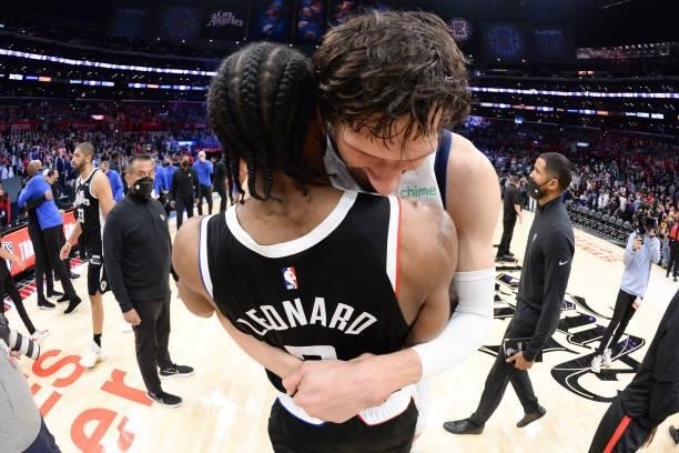 Boban Marjanovic of the Dallas Mavericks and Kawhi Leonard of the LA Clippers embrace after the game during Round 1, Game 7 of the 2021 NBA Playoffs...