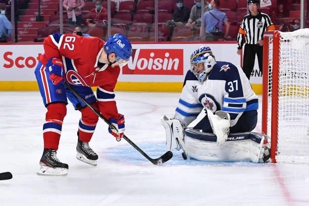 June 6: Goaltender Connor Hellebuyck of the Winnipeg Jets makes a save on a shot by Artturi Lehkonen of the Montreal Canadiens in Game Three of the...