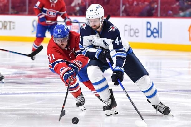 June 6: Brendan Gallagher of the Montreal Canadiens fights for the puck against Josh Morrissey of the Winnipeg Jets in Game Three of the Second Round...