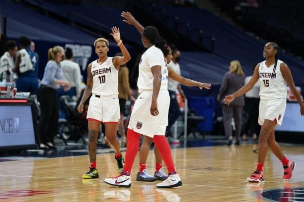 Courtney Williams of the Atlanta Dream high fives Shekinna Stricklen of the Atlanta Dream during the game against the Minnesota Lynx on June 6, 2021...