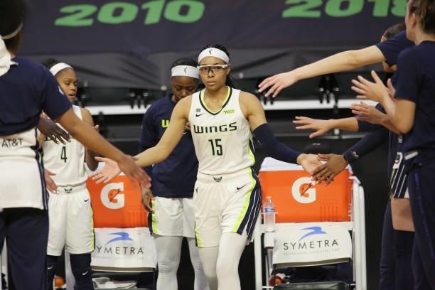Allisha Gray of the Dallas Wings high fives her teammates before the game against the Seattle Storm on June 6, 2021 at the Angel of the Winds Arena...