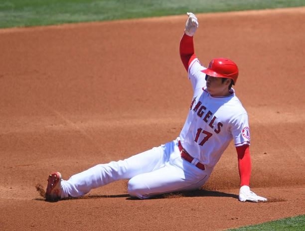 Shohei Ohtani of the Los Angeles Angels slides into second with a stolen base in the first inning of the game against the Seattle Mariners at Angel...