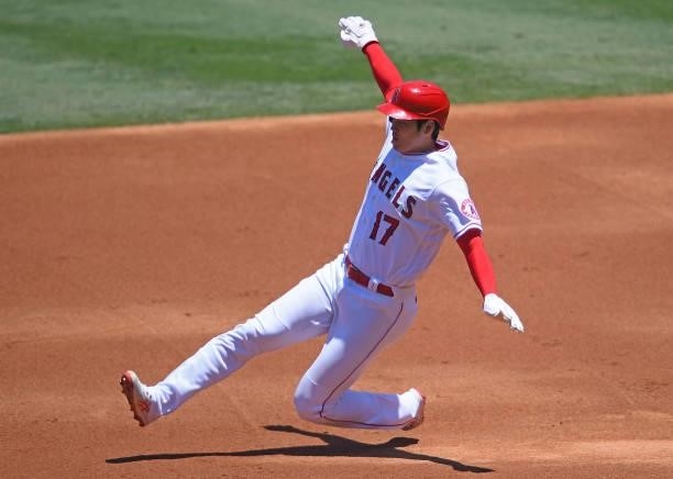 Shohei Ohtani of the Los Angeles Angels slides into second with a stolen base in the first inning of the game against the Seattle Mariners at Angel...